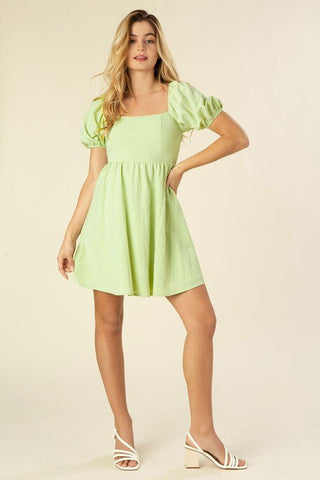 Green Whisper A Line Summer Dress - bright green mini dress with puff sleeves and smocked waist. #Firefly Lane Boutique1