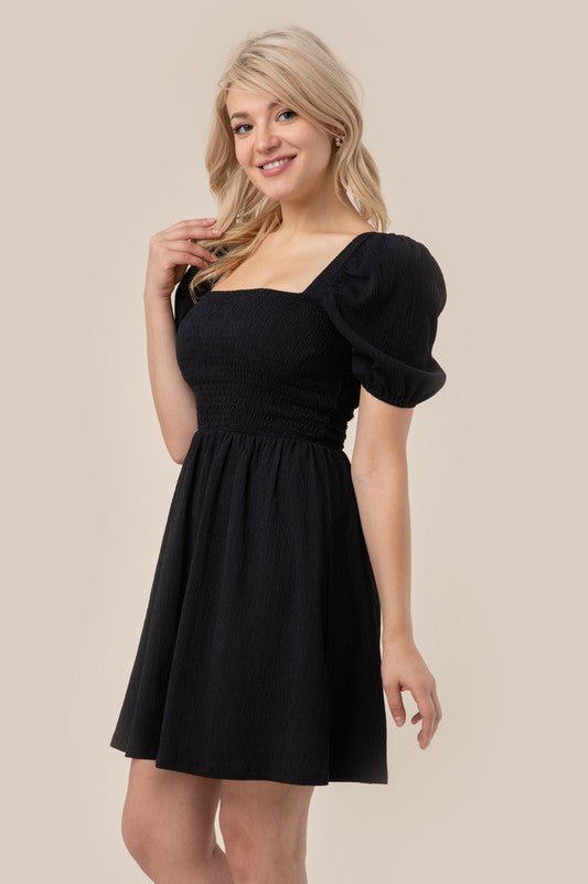 Mini A Line Summer Black Dress with a square neck, puff sleeves, and smocked waist! #Firefly Lane Boutique1